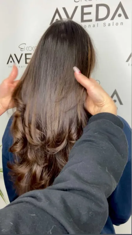 Brunette hair styling inside El Coco Cape Cod salon
